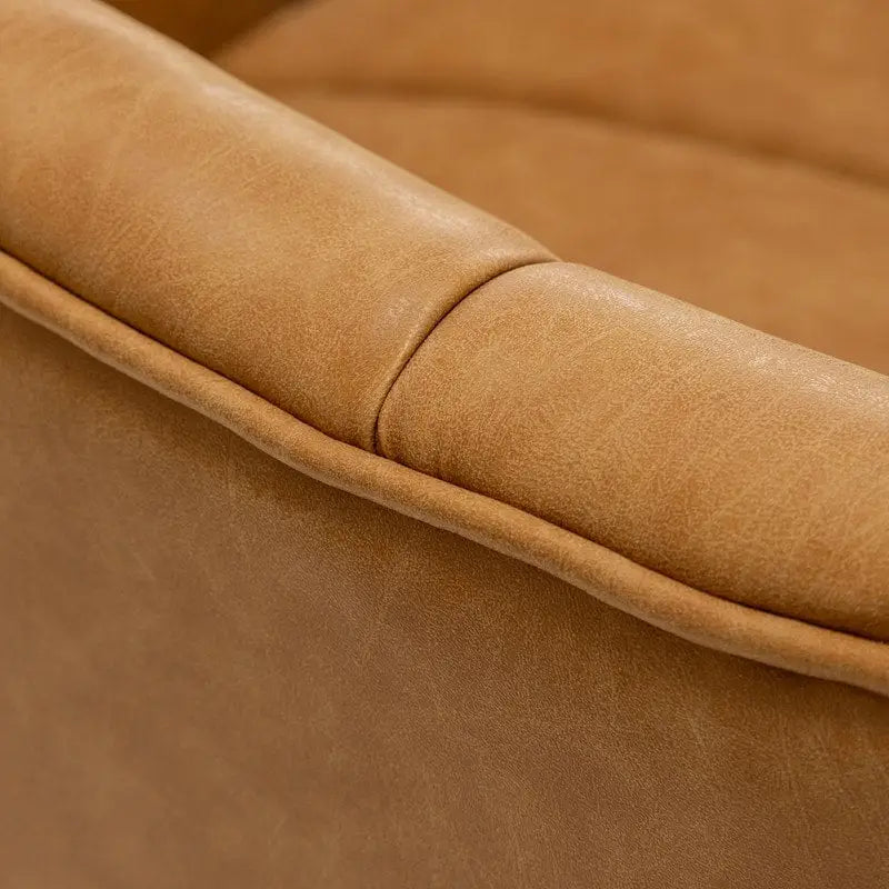 Fauteuil pivotant rond rembourré en cuir synthétique de style Mid-Century